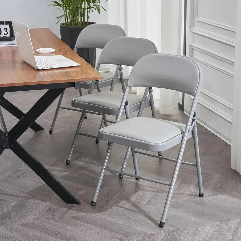 Chaises élégantes pliables en fer et PVC blanc pour congrès et expositions