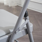 Chaises élégantes pliables en fer et PVC blanc pour congrès et expositions